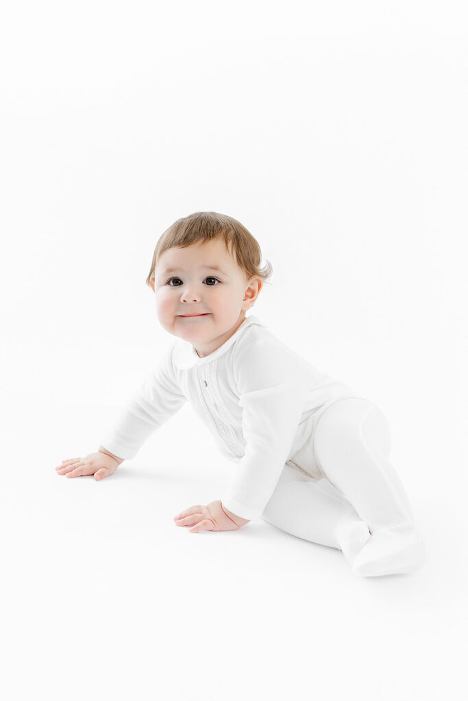 NYC first birthday photography, baby boy crawling white background, Heirloom by Melissa Photography Manhattan