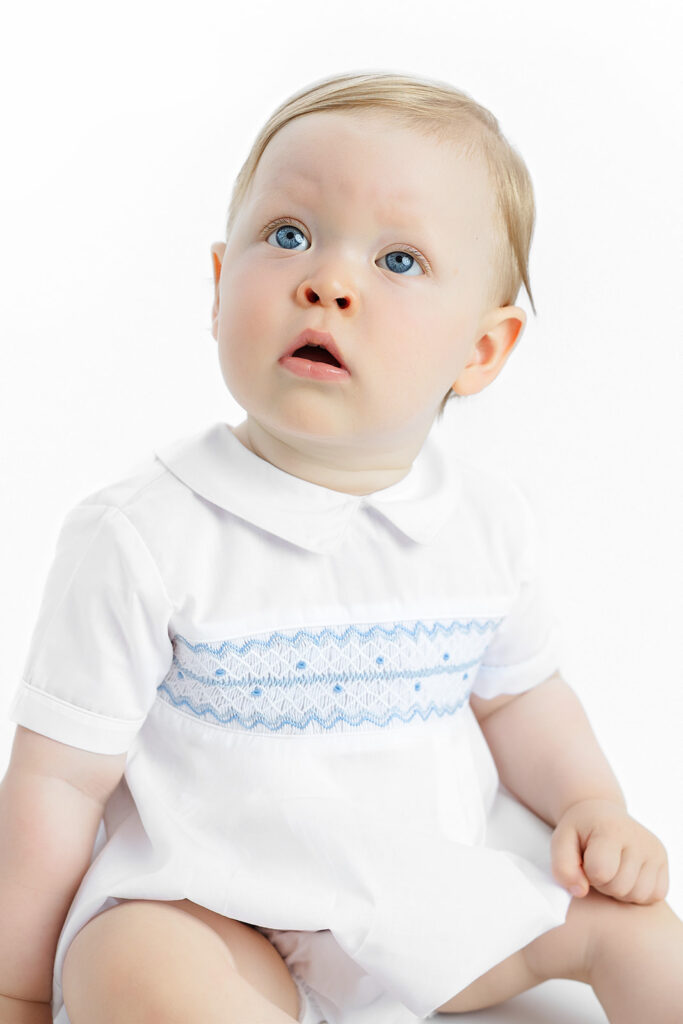 NYC first birthday photoshoot, baby boy in Feltman Brothers smocked romper, Heirloom by Melissa
