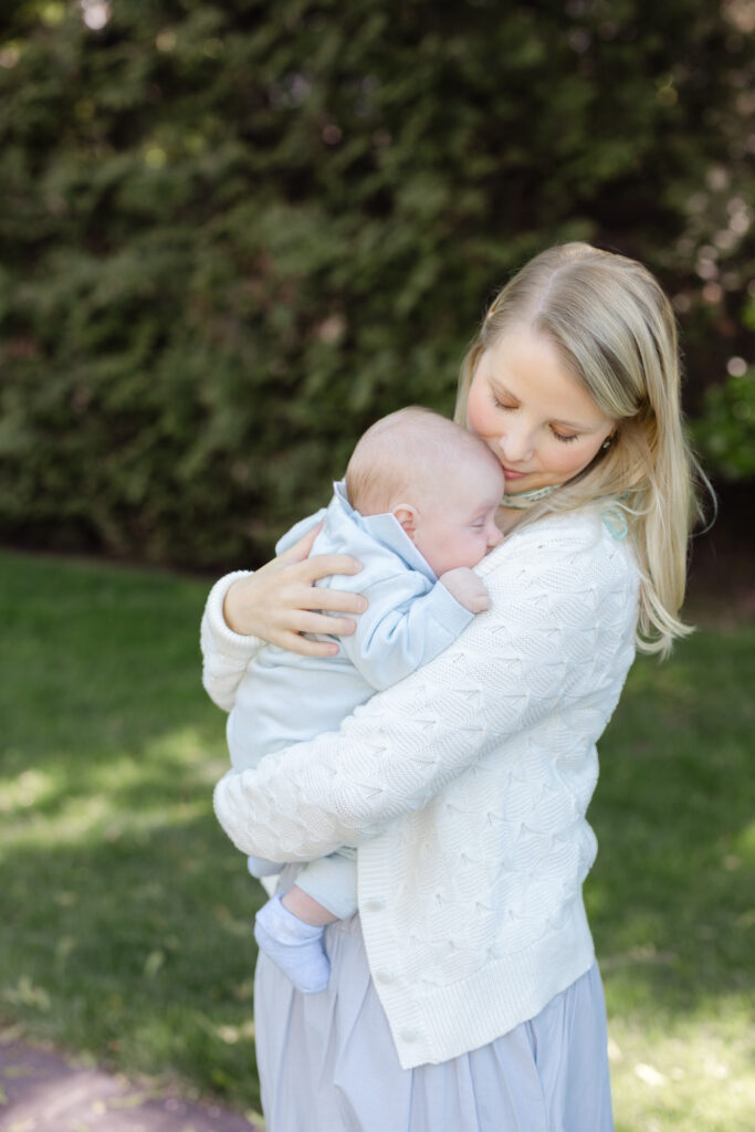Family walking outdoors together during lifestyle newborn session in NYC