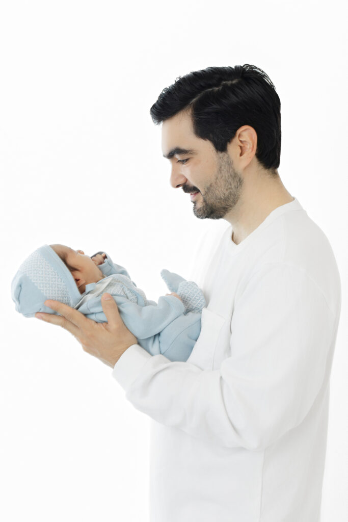 NYC studio newborn photographer dad and newborn portrait