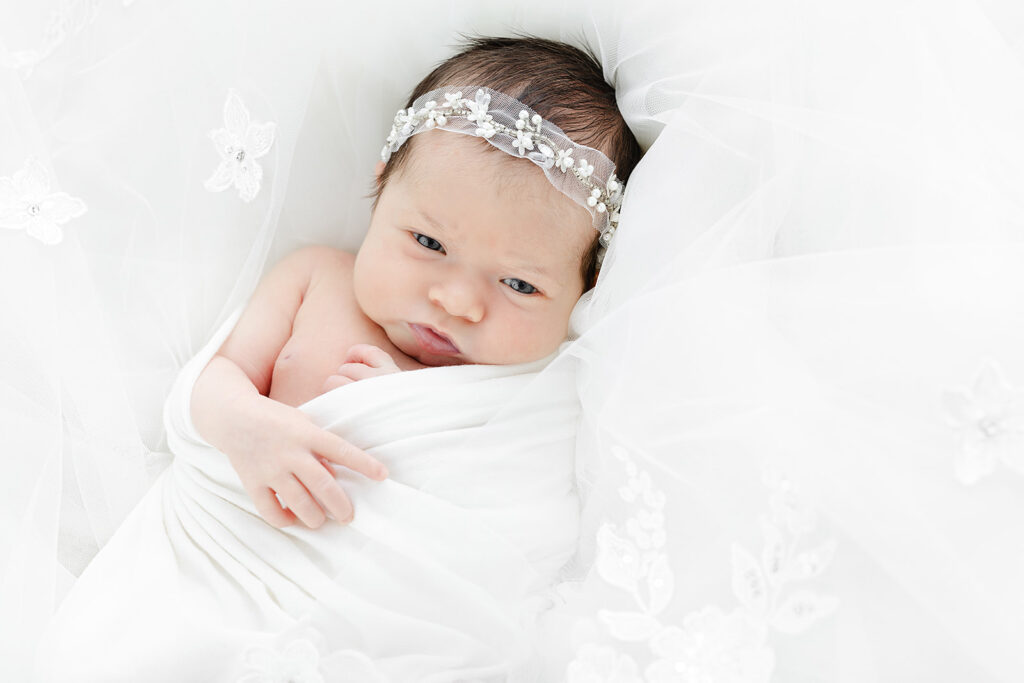 NYC newborn photography close up, newborn baby girl sleeping with pearl bow headband, Heirloom by Melissa Flatiron
