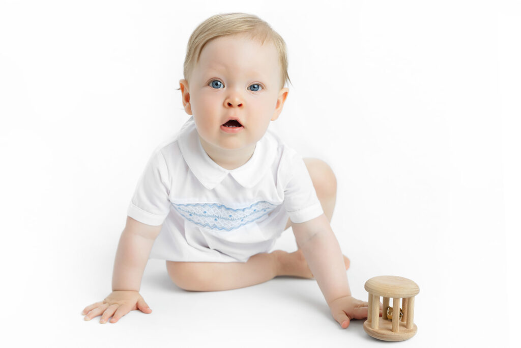 NYC first birthday photoshoot, one year old baby boy crawling smocked outfit, Heirloom by Melissa