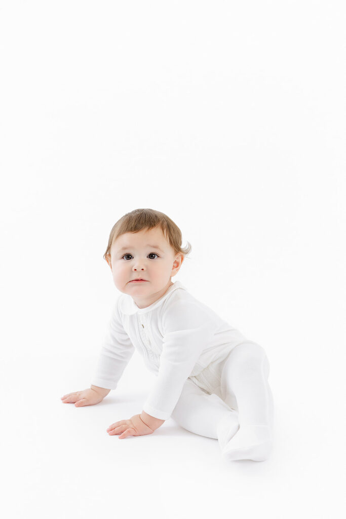 NYC first birthday photography, baby boy Paz Rodriguez white outfit sitting, Heirloom by Melissa Flatiron