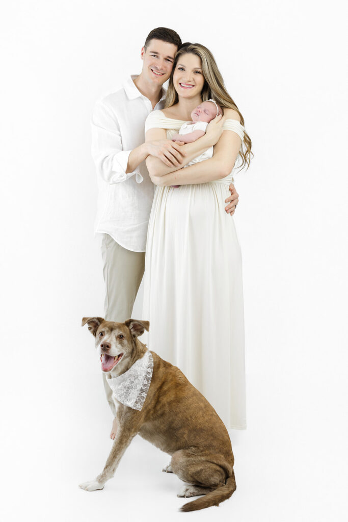 Flatiron newborn photographer, parents and newborn daughter portrait at Heirloom by Melissa, NYC