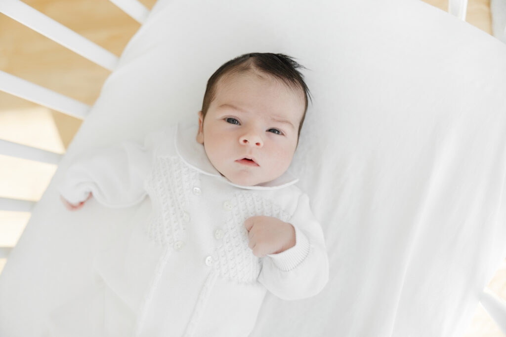 Baby wearing feltman brothers outfit newborn session