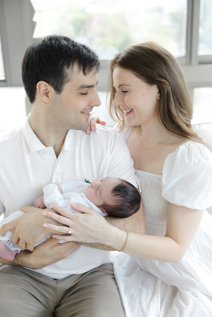 Father holding his newborn baby during a Manhattan newborn session