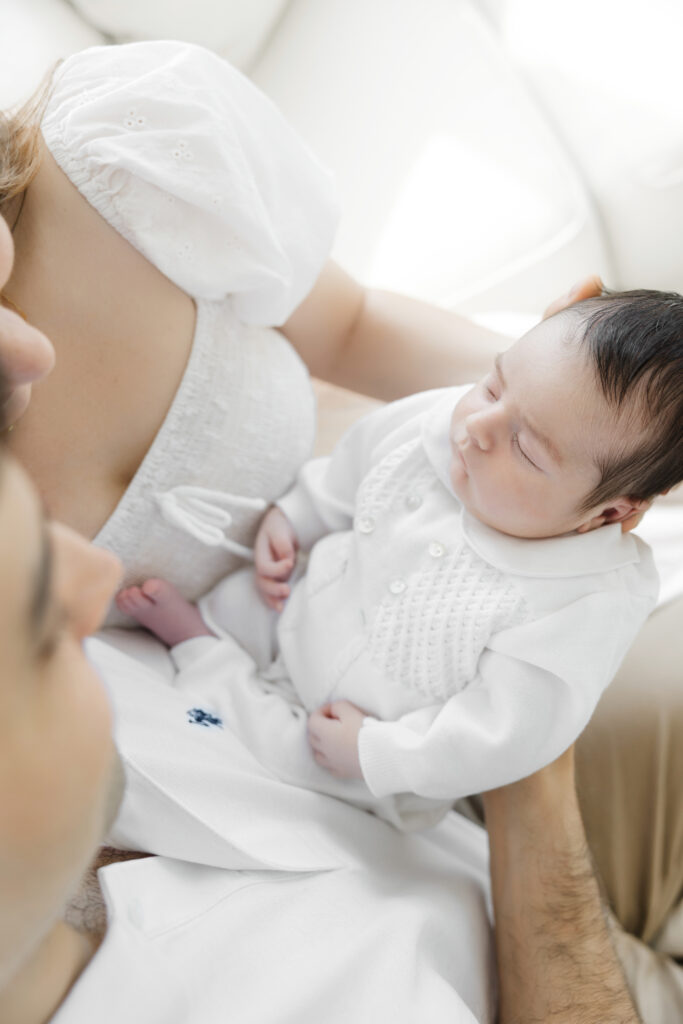 parents holding baby during an i home newborn session in manhattan