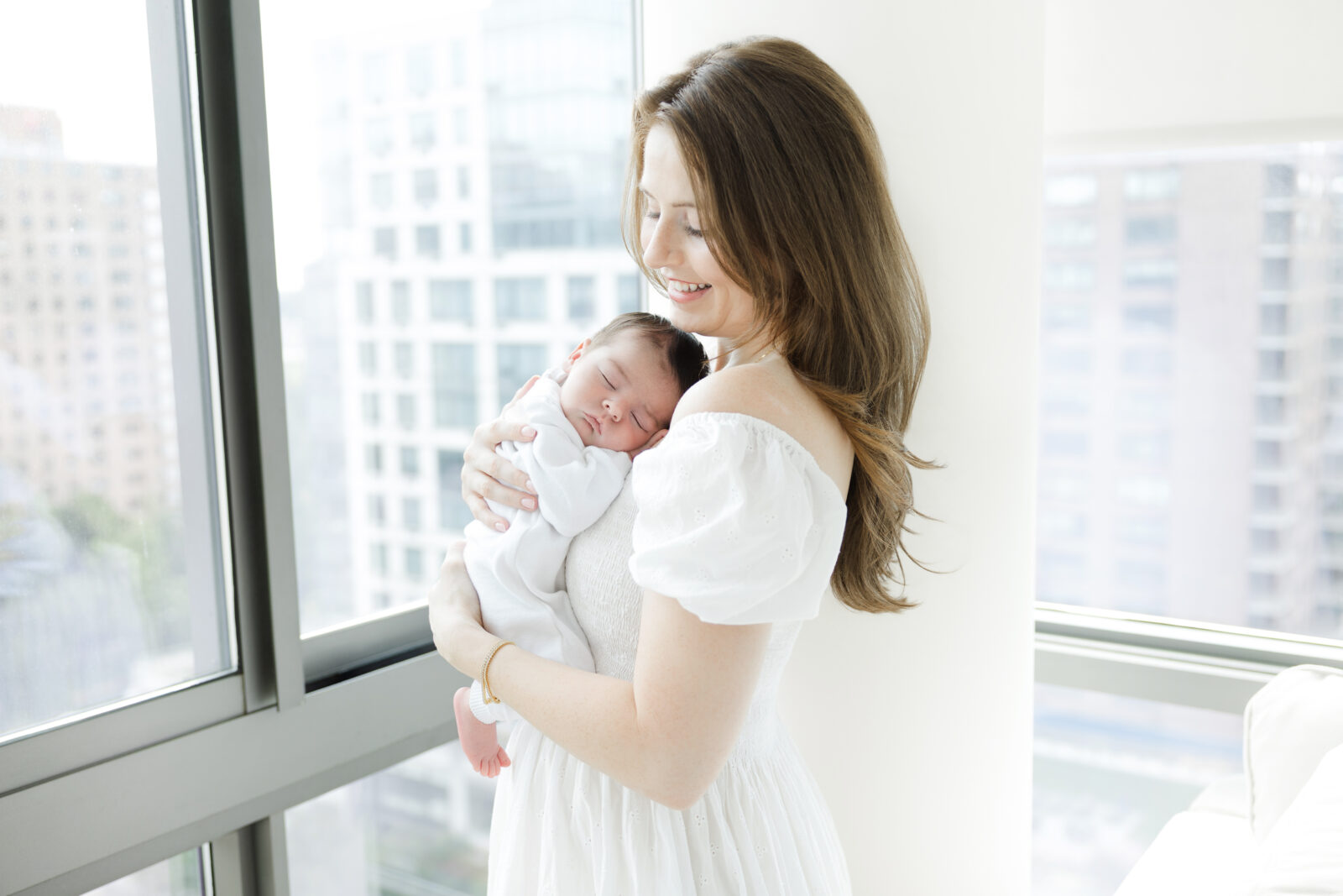Natural newborn portraits photographed inside a bright Manhattan nursery