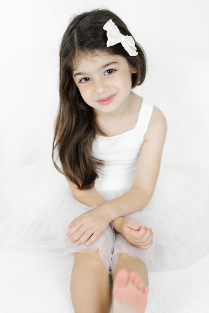Portrait of Soren’s older sister in a white and beige dress