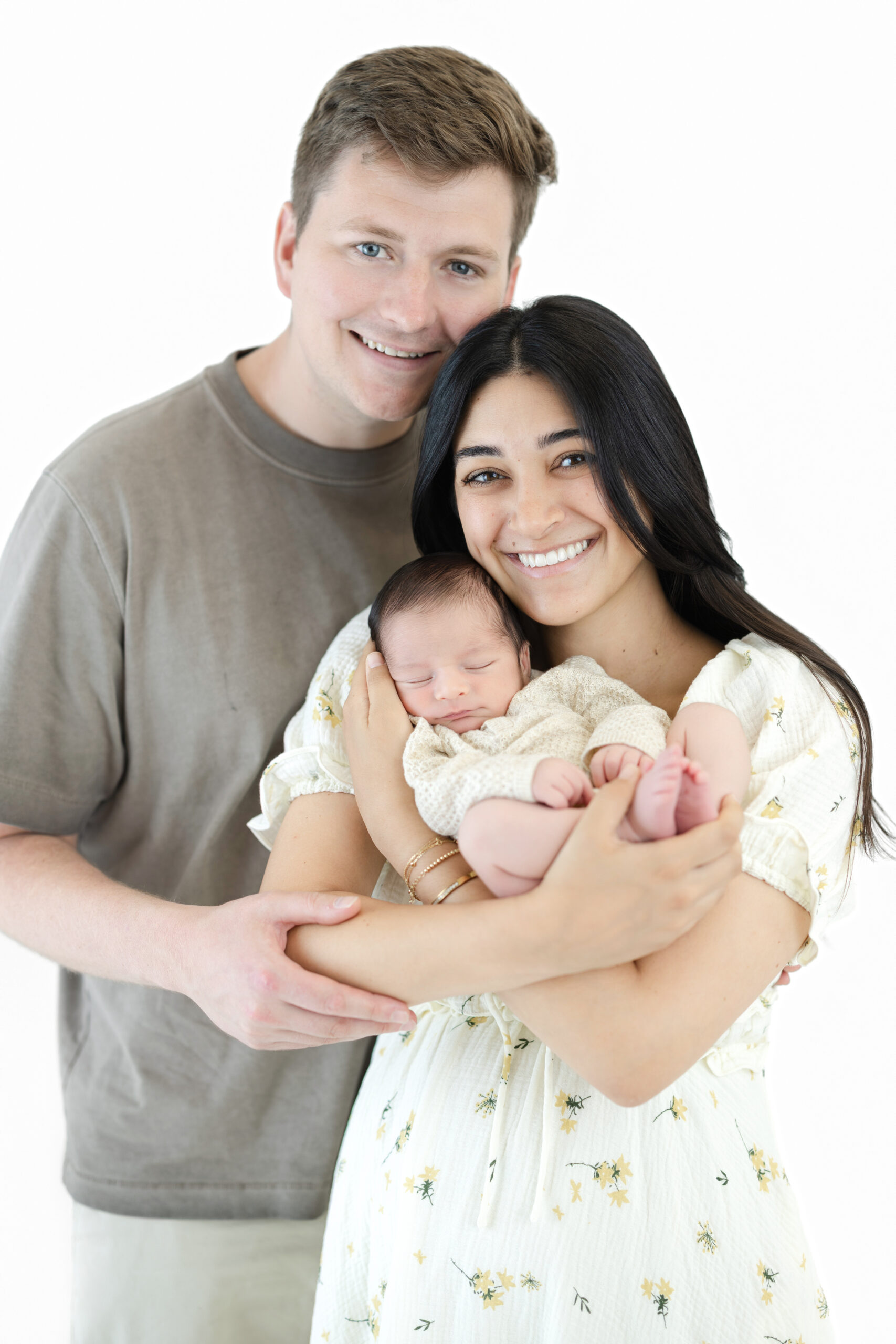 Mom and Dad holding their newborn son