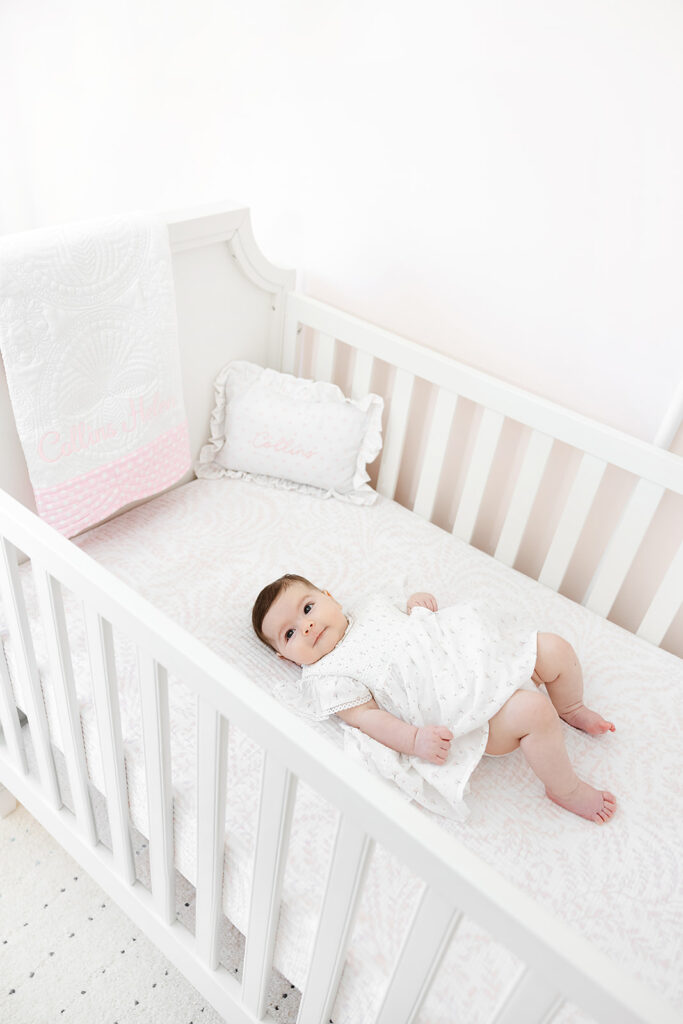 Smiling baby girl during her NYC three-month baby photos at home