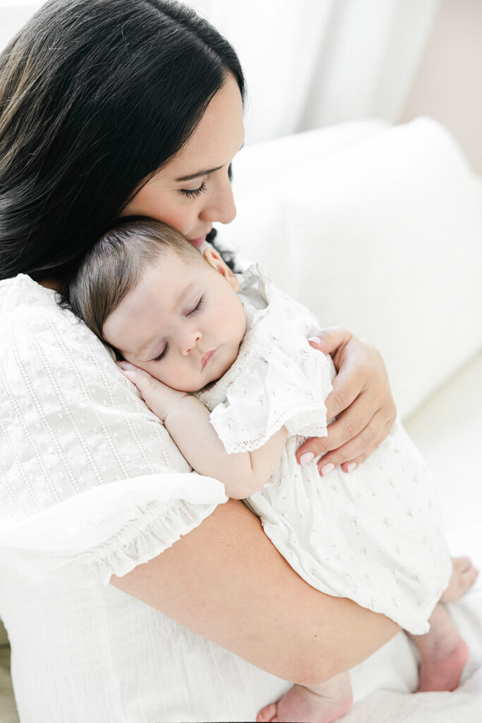 Three-month baby portrait in a soft white nursery in New York City