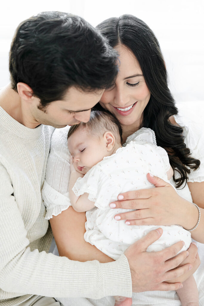 NYC three-month baby photos with a baby girl and her parents in their Manhattan nursery