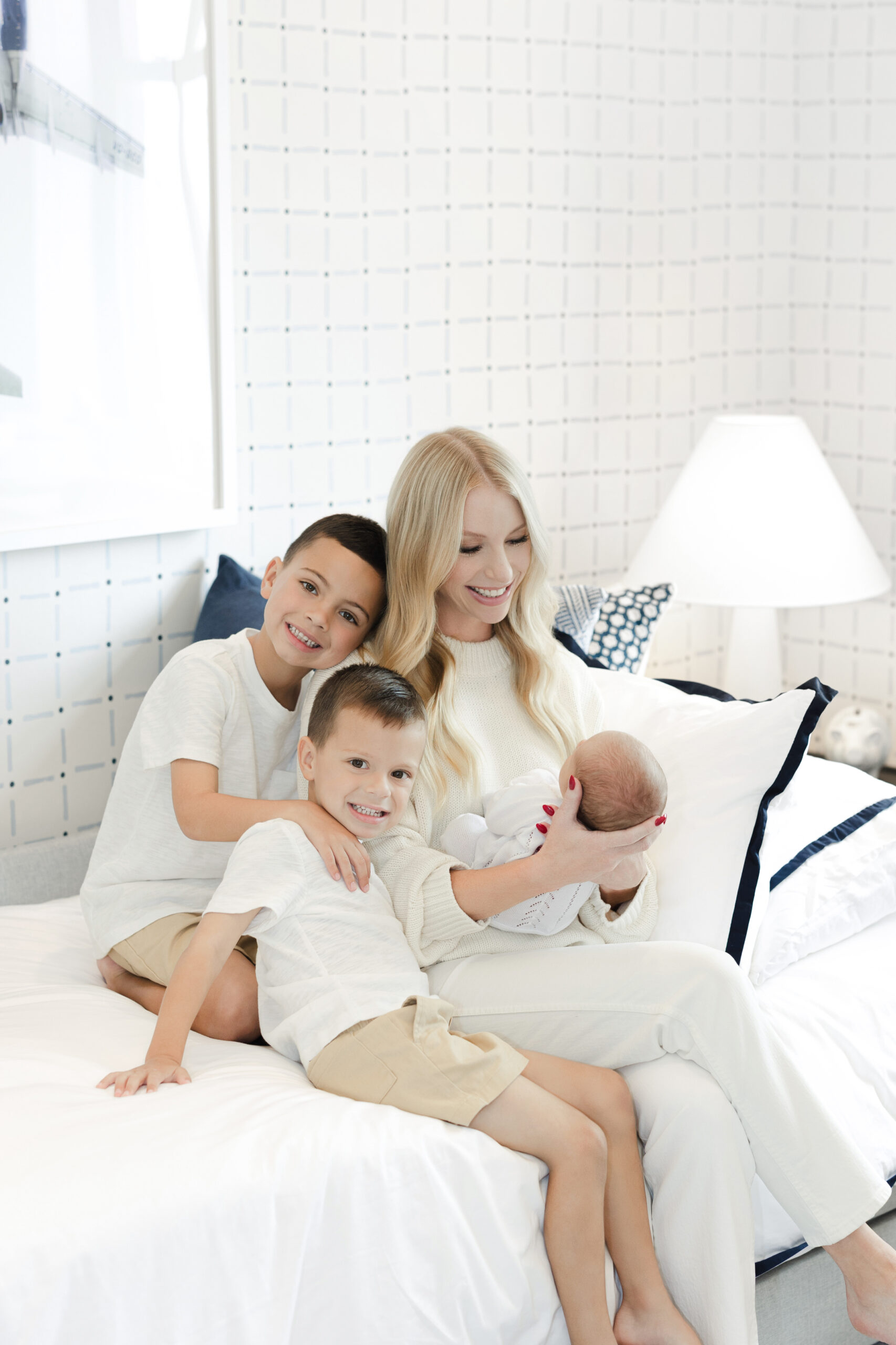 Mother and three children during an in-home newborn session in Tribeca
