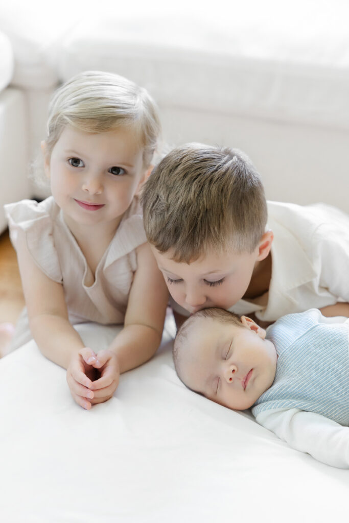 Three siblings during an in-home newborn session in Long Island