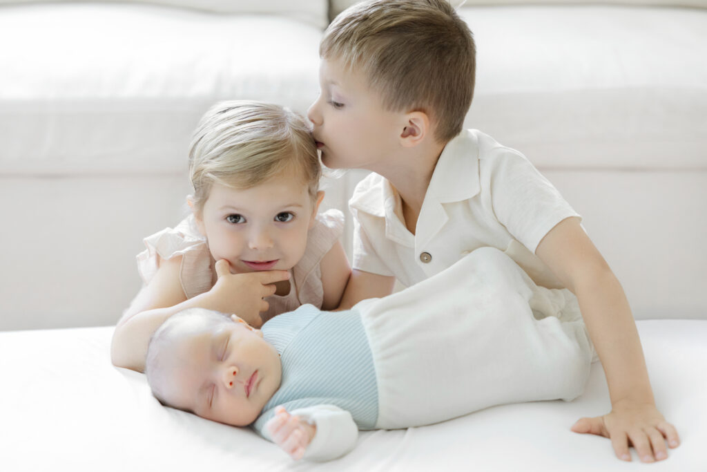 Three young siblings photographed in their Long Island home