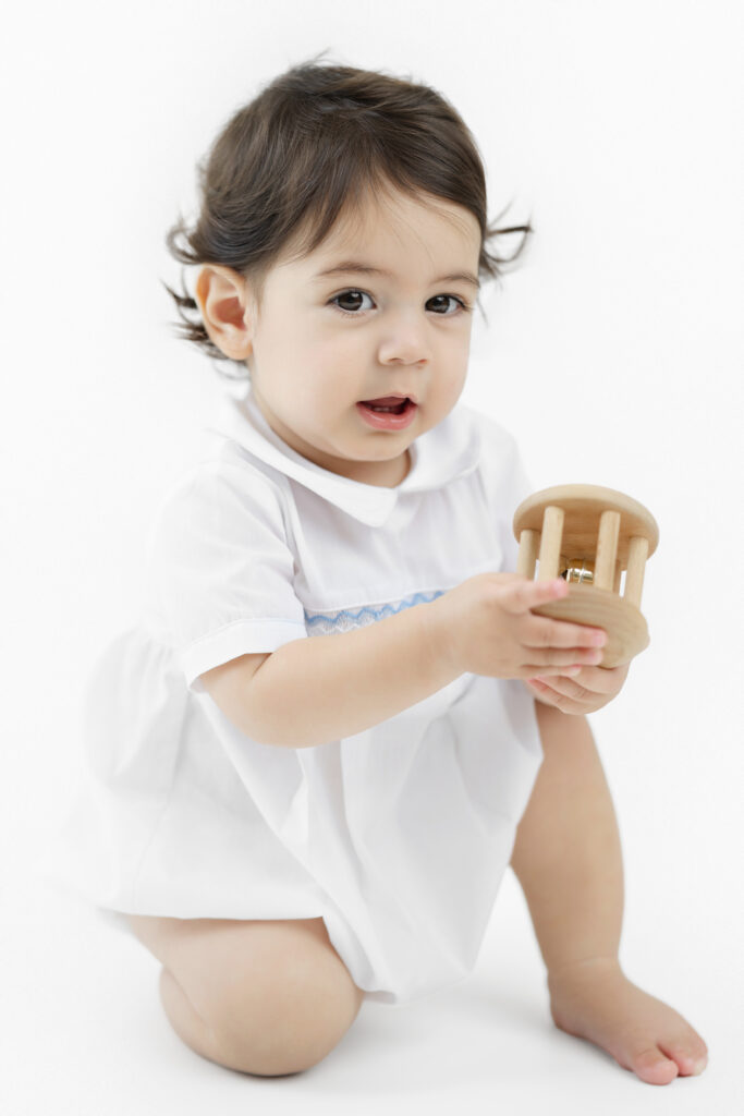 One-year-old Soren smiling during his NYC studio portraits