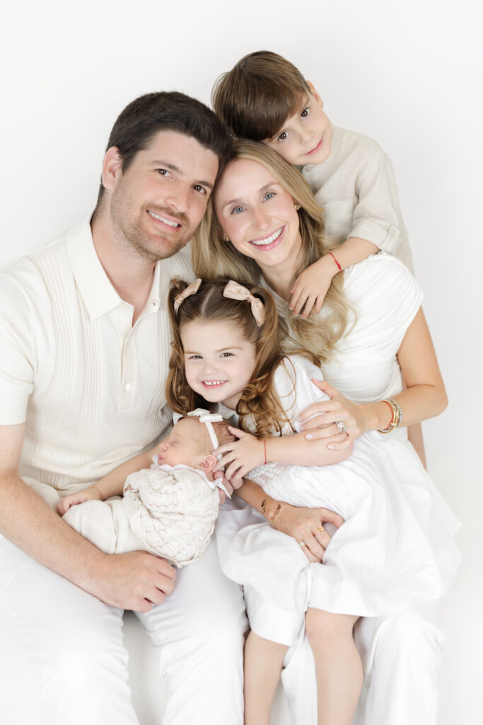 Family of five together during an NYC newborn session with siblings