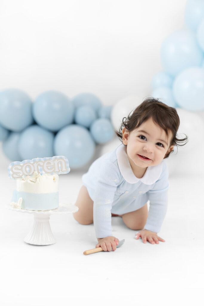 One-year-old Soren smiling during his NYC studio portraits