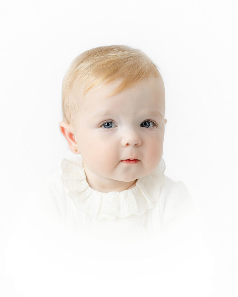 Timeless close-up portrait of a baby girl during her first birthday session in NYC