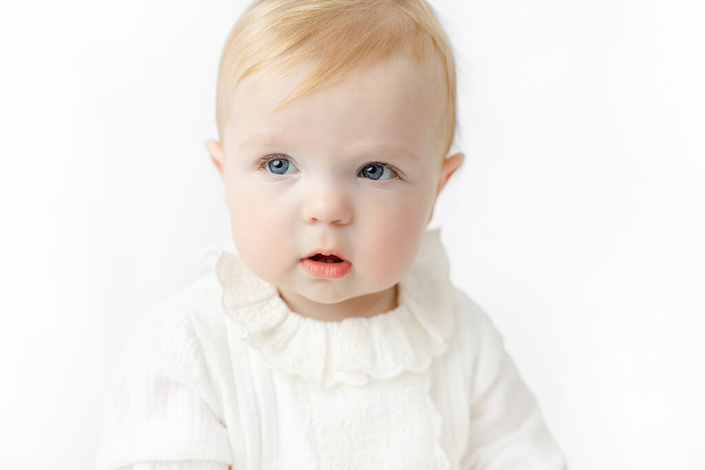 Close-up of a baby girl with blue eyes during a Manhattan milestone session