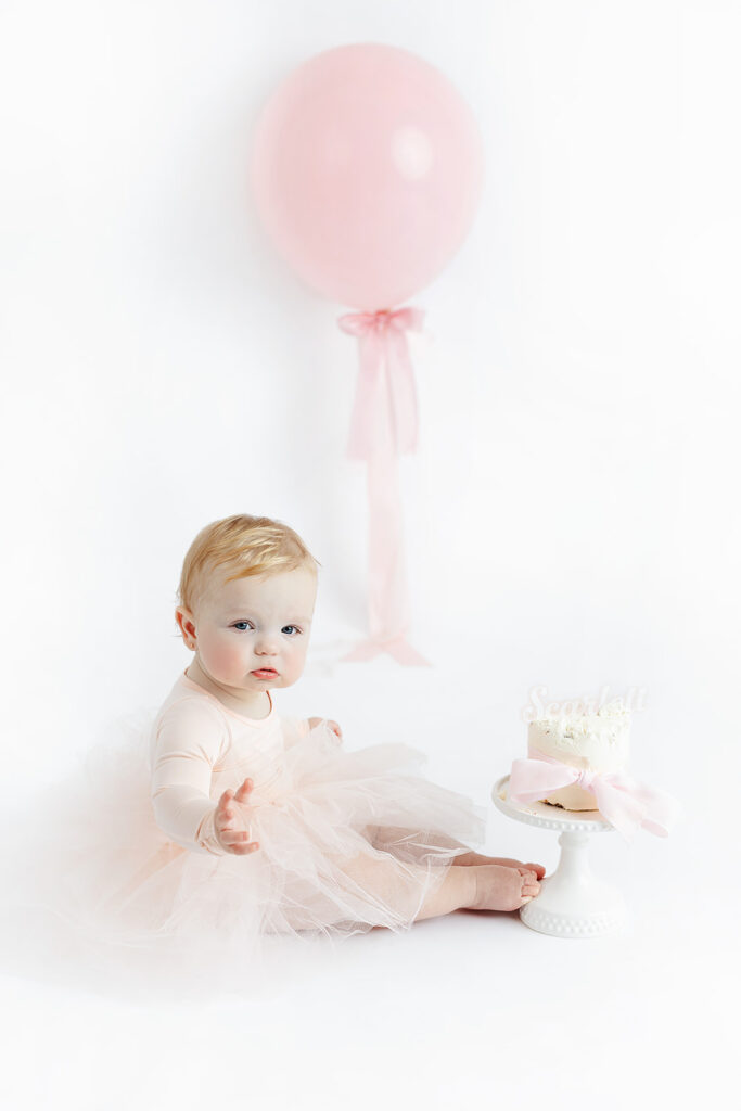 

Classic white studio portrait of a baby girl celebrating her first birthday