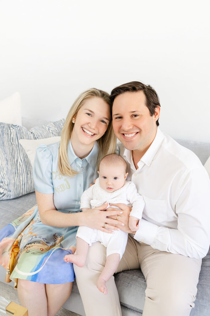 Close portrait of a baby girl with her parents during an in-home newborn session in Manhattan