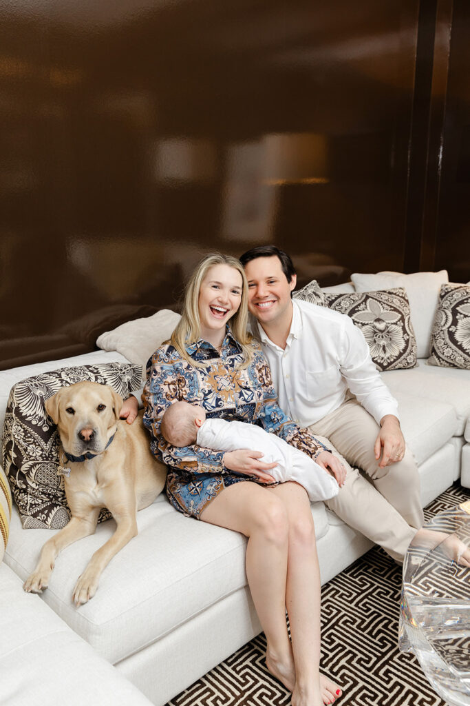 Manhattan in-home newborn photography with new parents, their baby girl, and Labrador